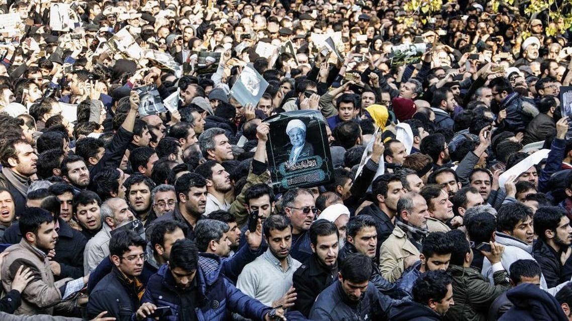 Iranians gather around a hearse carrying the coffin of former president Akbar Hashemi Rafsanjani during his funeral ceremony in the capital Tehran, on January 10, 2017. (AFP)