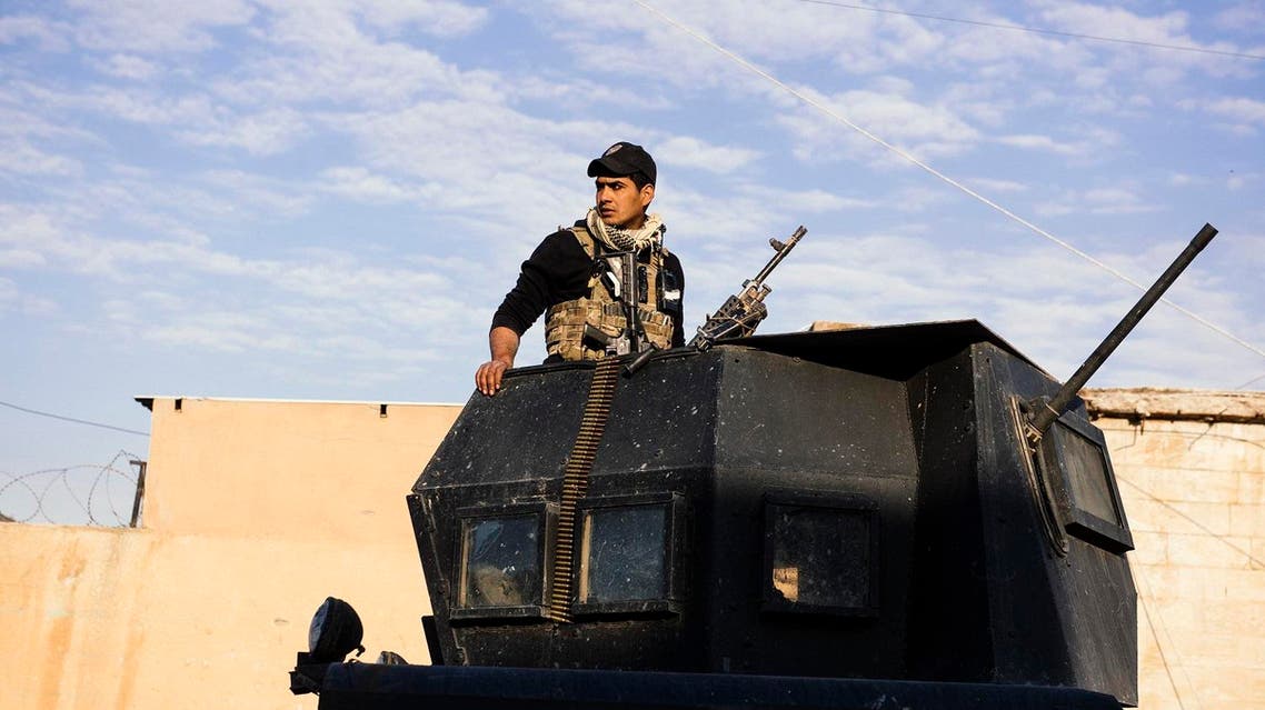 A member of the Iraqi special forces Counter Terrorism Service (CTS) patrols a street with an armoured vehicle in Mosul's Al-Zahraa neighbourhood. (AFP)