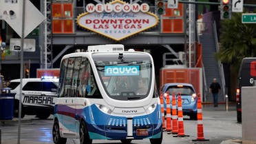 In this Jan. 12, 2017, photo, the Navya Arma autonomous vehicle drives down a street in Las Vegas. The driverless electric shuttle has begun carrying passengers in a test program in a downtown Las Vegas entertainment district. (AP)