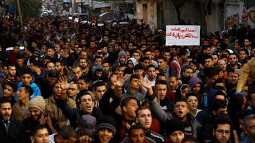 Palestinians chant slogans during a protest against the ongoing electricity crisis in Jabalia refugee camp in the northern Gaza Strip on January 12, 2017. (AFP)