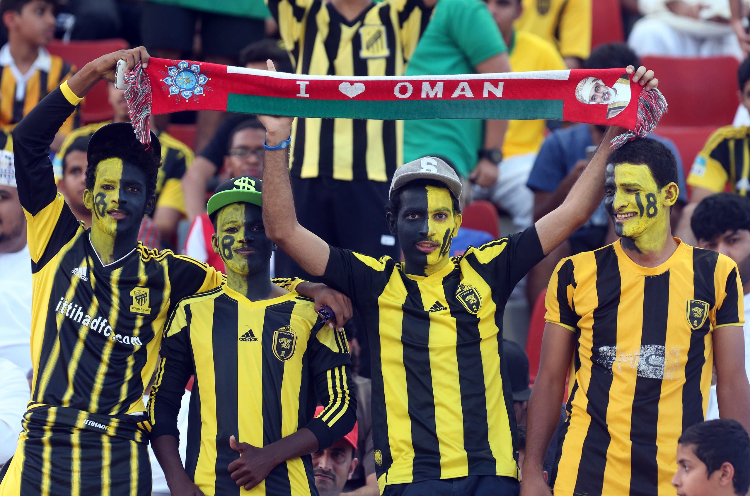 Saudi's Al-Ittihad club fans cheer on their team during their Asian Champions League group A football match against Iran's Sepahan club at the Sultan Qabous stadium in Muscat on May 4, 2016. MOHAMMED MAHJOUB / AFP