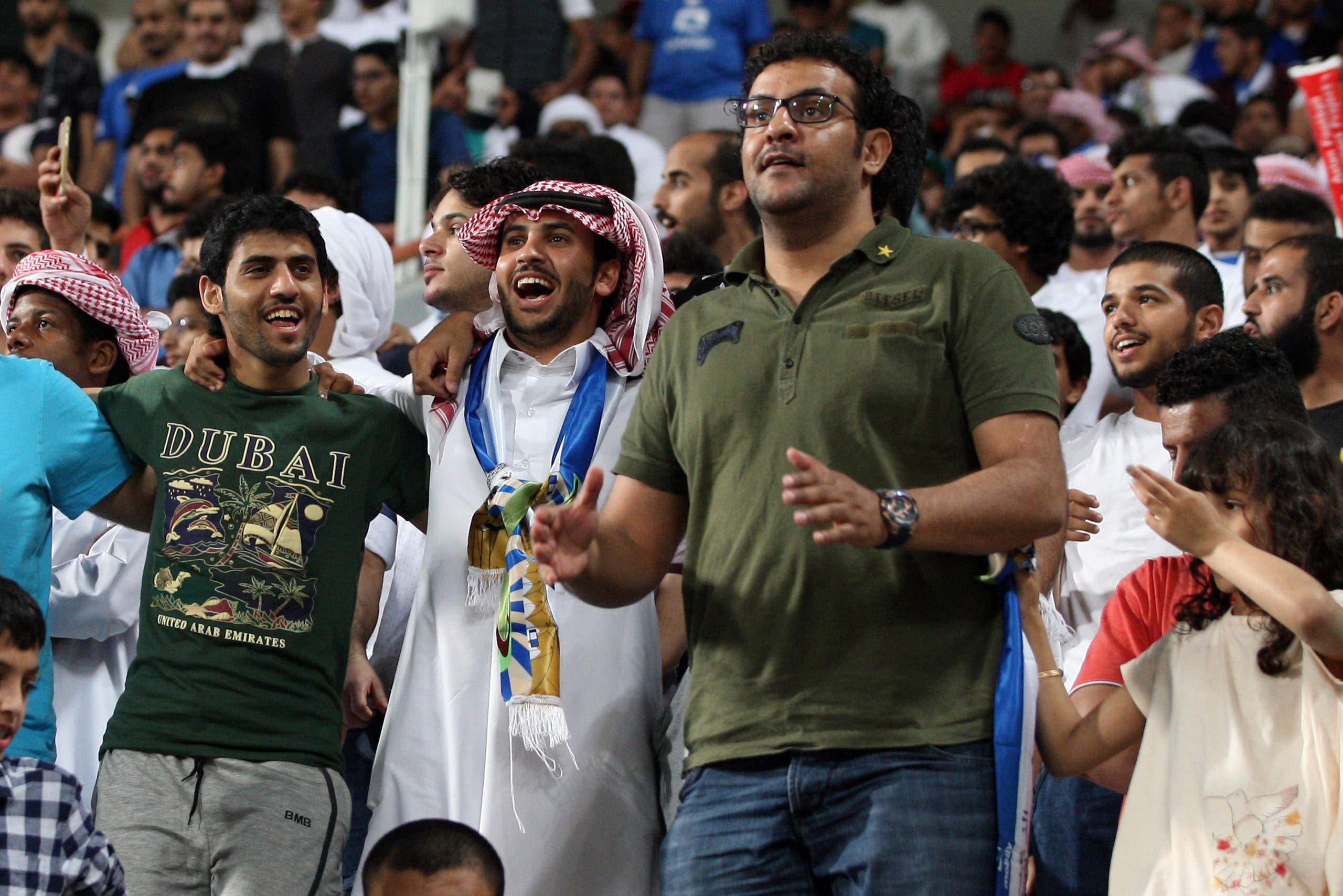 Supporters of Saudi club Al-Hilal cheer during an Asian Champions League group C football match against Emirati club Al-Jazira at Mohammed Bin Zayed Stadium on March 15, 2016 in Abu Dhabi. (AFP)