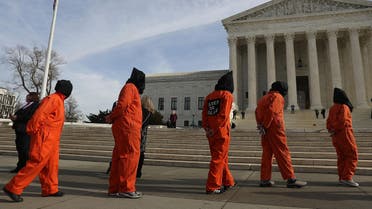 Protesters gather in front of the US Supreme Court to mark 15 years since the first prisoners were brought to the US detention facility in Guantanamo Bay, Cuba on January 11, 2017 in Washington, DC. (AFP)