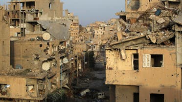 A view shows damaged buildings in Deir al-Zor, eastern Syria February 19, 2014. Picture taken February 19, 2014. REUTERS/Khalil Ashawi (SYRIA - Tags: CONFLICT CIVIL UNREST)gs: POLITICS CIVIL UNREST CONFLICT)