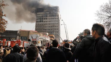 Firefighters battle a blaze that engulfed Iran's oldest high-rise, the 15-storey Plasco building in downtown Tehran on January 19, 2017