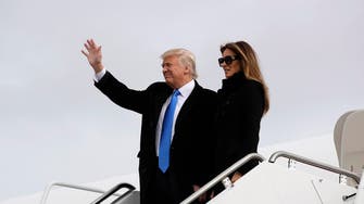 Trump arrives in Washington with a wave and a salute