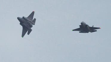 This picture taken on January 18, 2017 shows two US F-35B stealth fighter jets flying over the US Marine's Iwakuni Air Station in Iwakuni, Yamaguchi prefecture. The US Marine Corps said on January 11 it was sending a squadron of F-35B fighter jets to Japan, marking the first operational overseas deployment for the controversial aircraft that is under scrutiny from President-elect Donald Trump. AFP