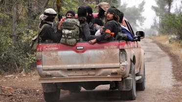 Rebel fighters from the Jaish al-Fatah brigades sit in the back of a truck as they take part in a major assault on Syrian government forces West of Aleppo city on October 28, 2016. (File photo: AFP)