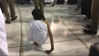Qatari boy performs the Umrah by walking on his hands