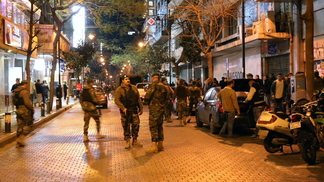 Lebanese security forces secure the street near the cafe in Hamra street in Beirut where a suicide bomber was arrested minutes before exploding himself on January 22, 2017. (AFP)