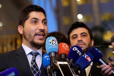 Member of the Syrian opposition delegation, Osama Abuzayd, left, speaks to the media as Issam El-Raees, right, stands next to him, after the talks on Syrian peace in Astana, Kazakhstan, Monday, Jan. 23, 2017. afp