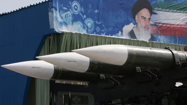 In this Sept. 22, 2011 file photo, a portrait of the late Iranian revolutionary founder Ayatollah Khomeini is seen behind Sam-6 missiles, displayed by Iran's Revolutionary Guard aP