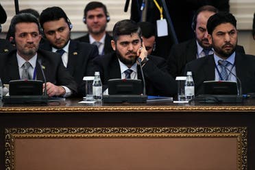 Chief opposition negotiator Mohammad Alloush (C) of the Jaish al-Islam (Army of Islam) rebel group attends the first session of Syria peace talks at Astana's Rixos President Hotel on January 23, 2017.  afp