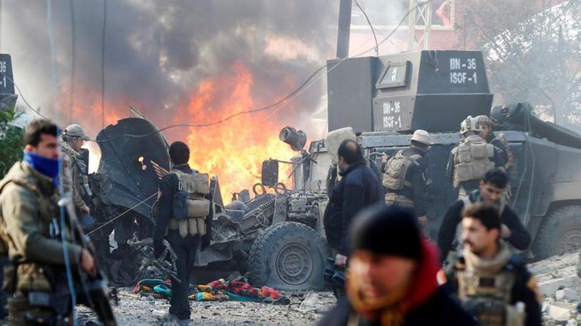 Iraqi Special Operations Forces (ISOF) react after a car bomb exploded during an operation to clear the al-Andalus district of ISIS militants, in Mosul, Iraq, January 16, 2017. (Reuters)