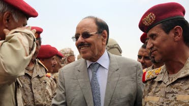 Yemeni Vice President General Ali Mohsen al-Ahmar (C) shakes hands with army officers as he visits military barracks in the eastern city of Marib on August 15, 2016. AFP