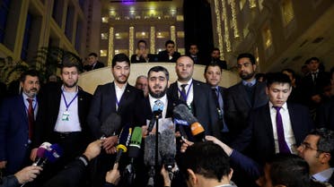 Mohammed Alloush, head of a Syrian opposition delegation, center, speaks to the media after the talks on Syrian peace in Astana, Kazakhstan, Tuesday, Jan. 24, 2017. Russia, Iran and Turkey _ sponsors of talks in Kazakhstan between Syria and rebel factions _ pledged Tuesday to consolidate the country's nearly month-old cease-fire and set up a three-way mechanism to ensure compliance of all sides. (AP)