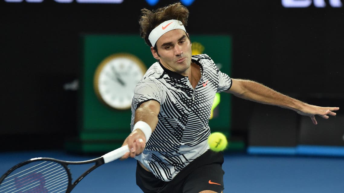 Switzerland's Roger Federer hits a return against Switzerland's Stanislas Wawrinka during their men's singles semi-final match on day 11 of the Australian Open tennis tournament in Melbourne on January 26, 2017. (AFP)
