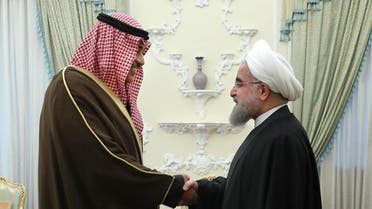 A handout picture provided by the office of Iranian President Hassan Rouhani shows him (R) shaking hands with Kuwait's Foreign Minister Sabah Al-Khalid Al-Sabah in the capital Tehran, on January 25, 2017. (AFP)