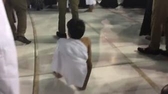 Disabled Qatari boy performs Umrah by walking on hands
