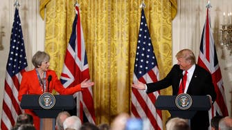 Trump wants good relationship with Russia, May says sanctions should stay