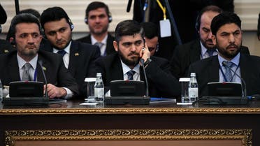 Chief opposition negotiator Mohammad Alloush (C) of the Jaish al-Islam (Army of Islam) rebel group attends the first session of Syria peace talks at Astana's Rixos President Hotel on January 23, 2017. (AFP)