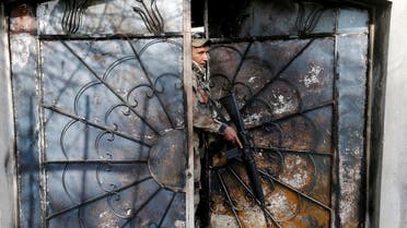 A member of the Iraqi army holds his weapon during an operation to search for weapons in the Arabi neighborhood in Mosul. (Reuters)