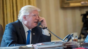  President Donald Trump speaks on the phone with Russian President Vladimir Putin, Saturday, Jan. 28, 2017, in the Oval Office at the White House in Washington. (AP Photo/Andrew Harnik)