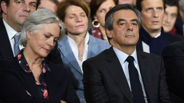 Francois Fillon (R) with his wife Penelope (L) during a campaign rally on January 29, 2017 in Paris (AFP)