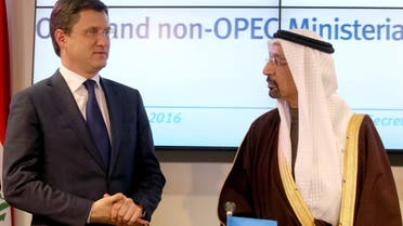 Russian Minister of Energy Alexander Novak (left), and Khalid al-Falih, Minister of Energy, Industry and Mineral Resources of Saudi Arabia finish a news conference after a meeting of OPEC, in Vienna, Austria, on Dec. 10, 2016. (AP)