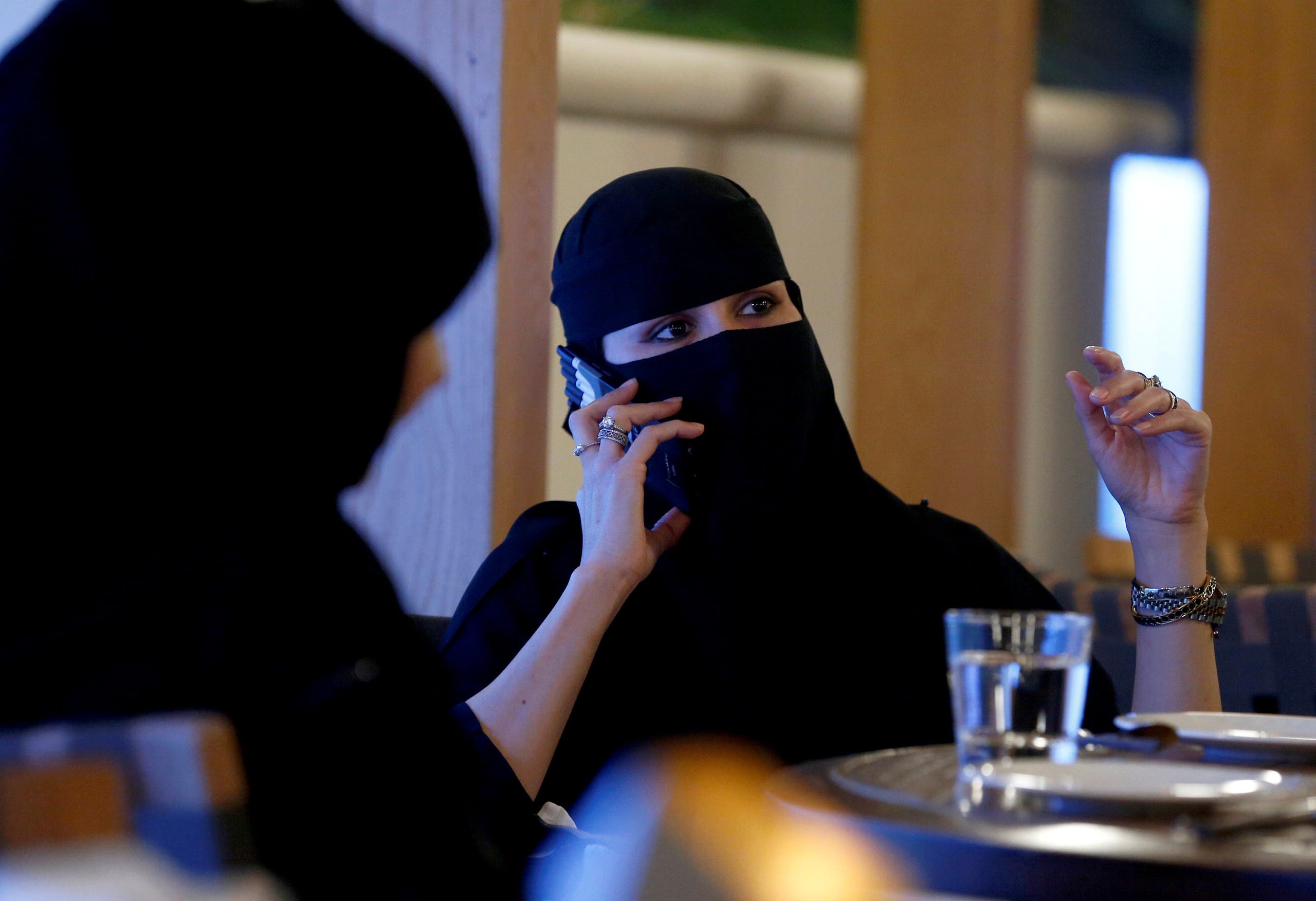 A woman speaks on a mobile phone in a cafe in Riyadh, Saudi Arabia October 6, 2016. (Reuters)