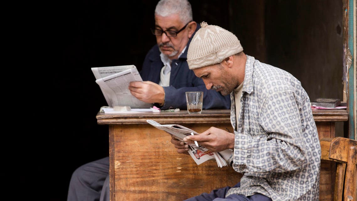 People read newspapers at a shop in Cairo, on Friday, Jan. 20, 2017. The IMF says Egypt is making progress with its economic reform program, although it will still take time to improve living standards for the whole population. (AP)