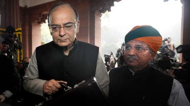 Indian Finance Minister Arun Jaitley (left), with junior finance minister Arjun Ram Meghwal, arrive to present federal budget at the Parliament house in New Delhi on Feb. 1, 2017. (AP)