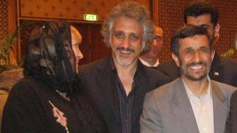 Ahmadinejad pictured with Italians arrested for smuggling arms