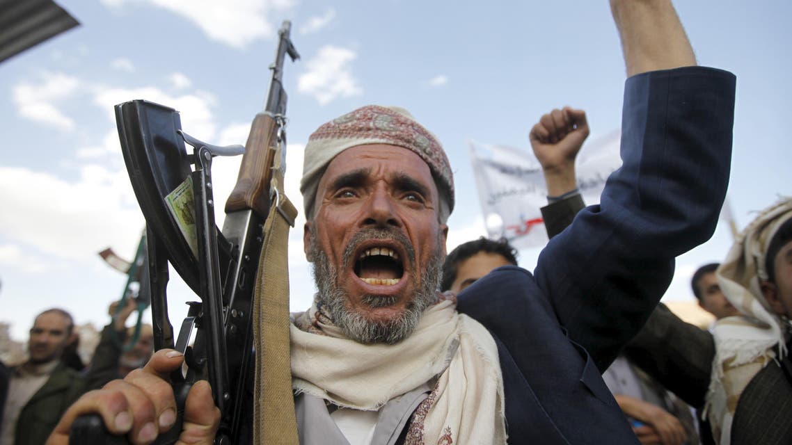 A follower of the Houthi shouts slogans as he raises his weapon during a rally against U.S. support to Saudi-led air strikes, in Yemen's capital Sanaa, March 1, 2016. reuters