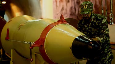 A handout picture released on March 8, 2016 by Sepah News, the online news site and public relations arm of Iran's Islamic Revolutionary Guard, shows a member of the Revolutionary Guards next to a missile launcher in an underground tunnel at an undisclosed location in Iran. Iran conducted multiple ballistic missile tests on March 8 in what it said was a display of "deterrent power," defying US sanctions imposed earlier this year aimed at disrupting its missile programme. State media announced that short-, medium- and long-range precision guided missiles were fired from several sites to show the country's "all-out readiness to confront threats" against its territorial integrity. (AFP)