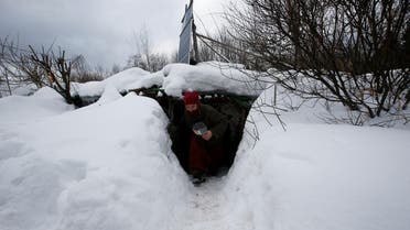 Yury Alekseyev, a former lawyer from Moscow who is called a "Russian hobbit", leaves his underground home in the forest on the side of the road northeast from Moscow, Russia February 3, 2017. REUTERS