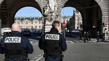 Policemen stand guard near the Louvre museum on February 3, 2017 in Paris, after a soldier patrolling at the museum shot and seriously injured a machete-wielding man who yelled "Allahu Akbar" ("God is greatest") as he attacked security forces, police said. One soldier was "lightly injured" and has been taken to hospital, while the knifeman is in a serious condition but is still alive, security forces said. Eric FEFERBERG / AFP