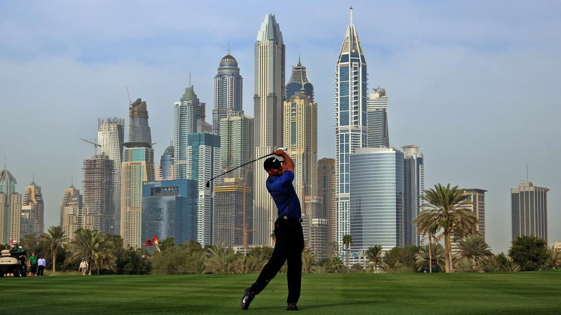Tiger Woods of the USA follows his ball after playing a shot during the Dubai Desert Classic golf tournament at the Emirates Golf Club in Dubai on February 2, 2017. NEZAR BALOUT / AFP