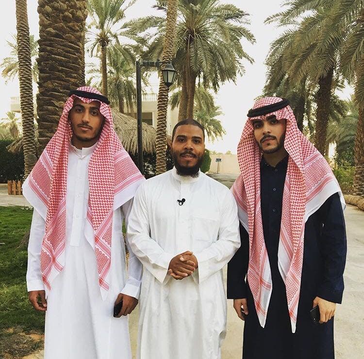 Mutah Beale with his business partners in Saudi Arabia. (Supplied)