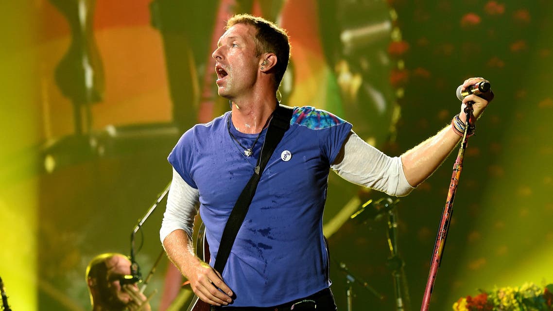 PASADENA, CA - AUGUST 20: Singer Chris Martin of Coldplay performs at the Rose Bowl on August 20, 2016 in Pasadena, California. Kevin Winter/Getty Images/AFP 