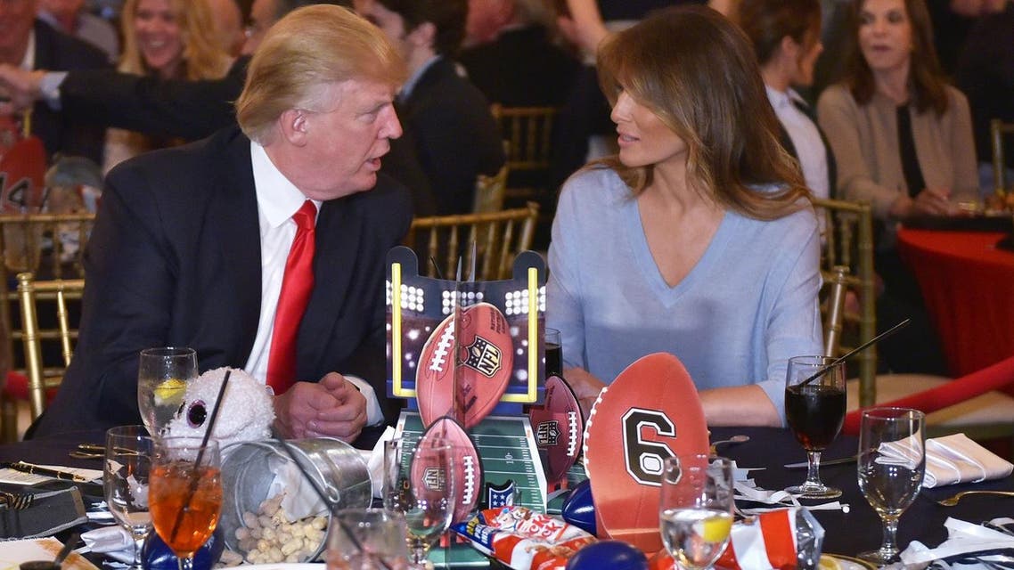 President Trump chats with First Lady Melania while watching the Super Bowl at Trump International Golf Club Palm Beach in Florida on February 5, 2017. (AFP)