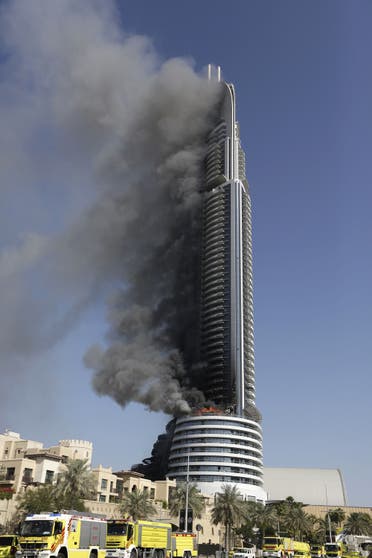 In this Friday, Jan. 1, 2016 photo, the fire continues to burn in the Address Downtown skyscraper in Dubai, United Arab Emirates (Photo: AP/Sunday Alamba)