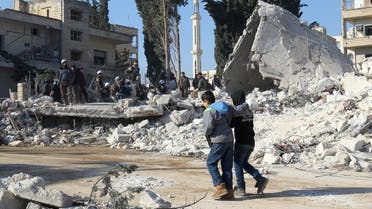 Boys walk at a site hit by airstrikes in the rebel-held city of Idlib, Syria February 7, 2017. REUTERS/Ammar Abdullah