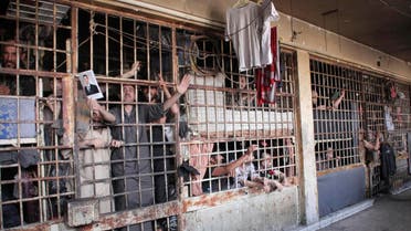 Syrians behind bars (Reuters)