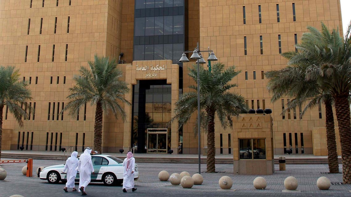 Saudi people seen near the entrance to the Riyadh general court in Riyadh, Saudi Arabia, Tuesday, Oct. 21, 2008. AP