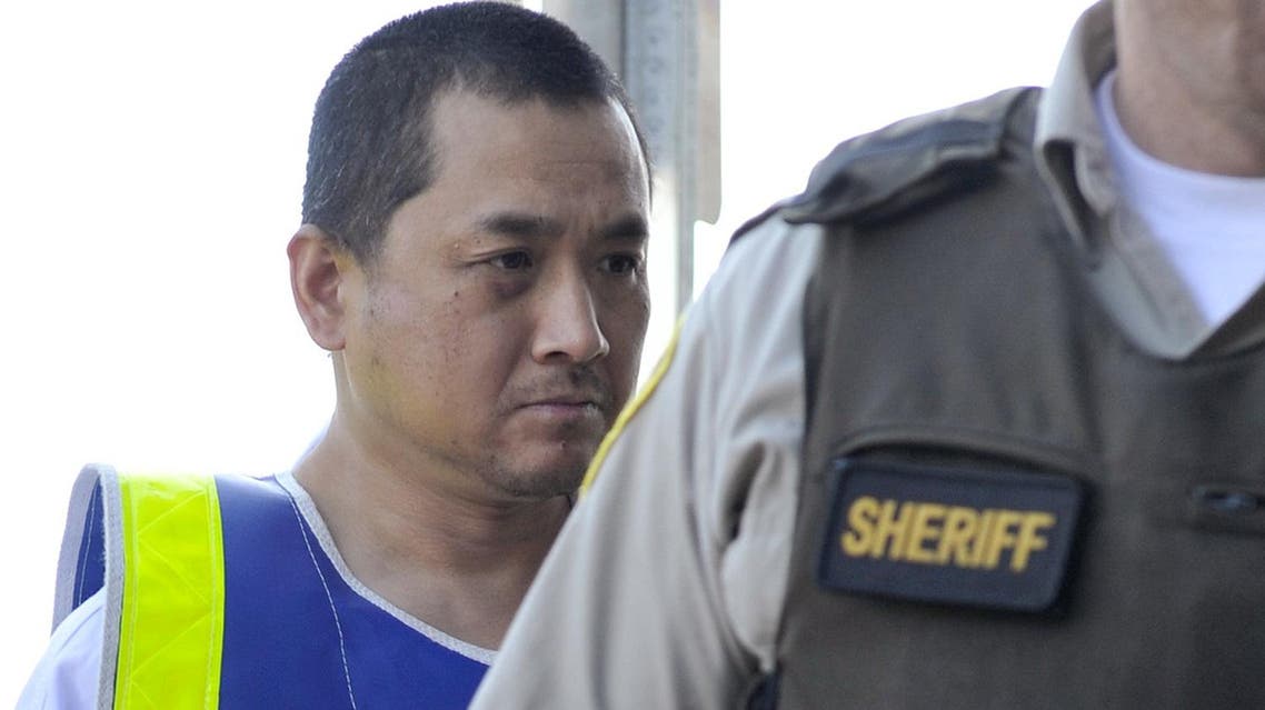 Will Baker, formerly known as Vince Weiguang Li (L) is escorted by sheriff officers on his way to a court appearance in Portage la Prairie August 5, 2008. REUTERS/Fred Greenslade (File Photo: Reuters)