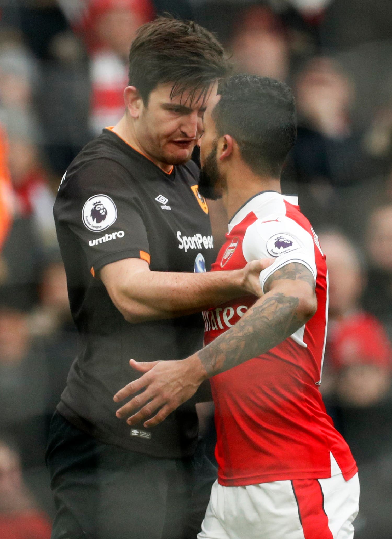 Theo Walcott (R) and Harry Maguire (L). Reuters