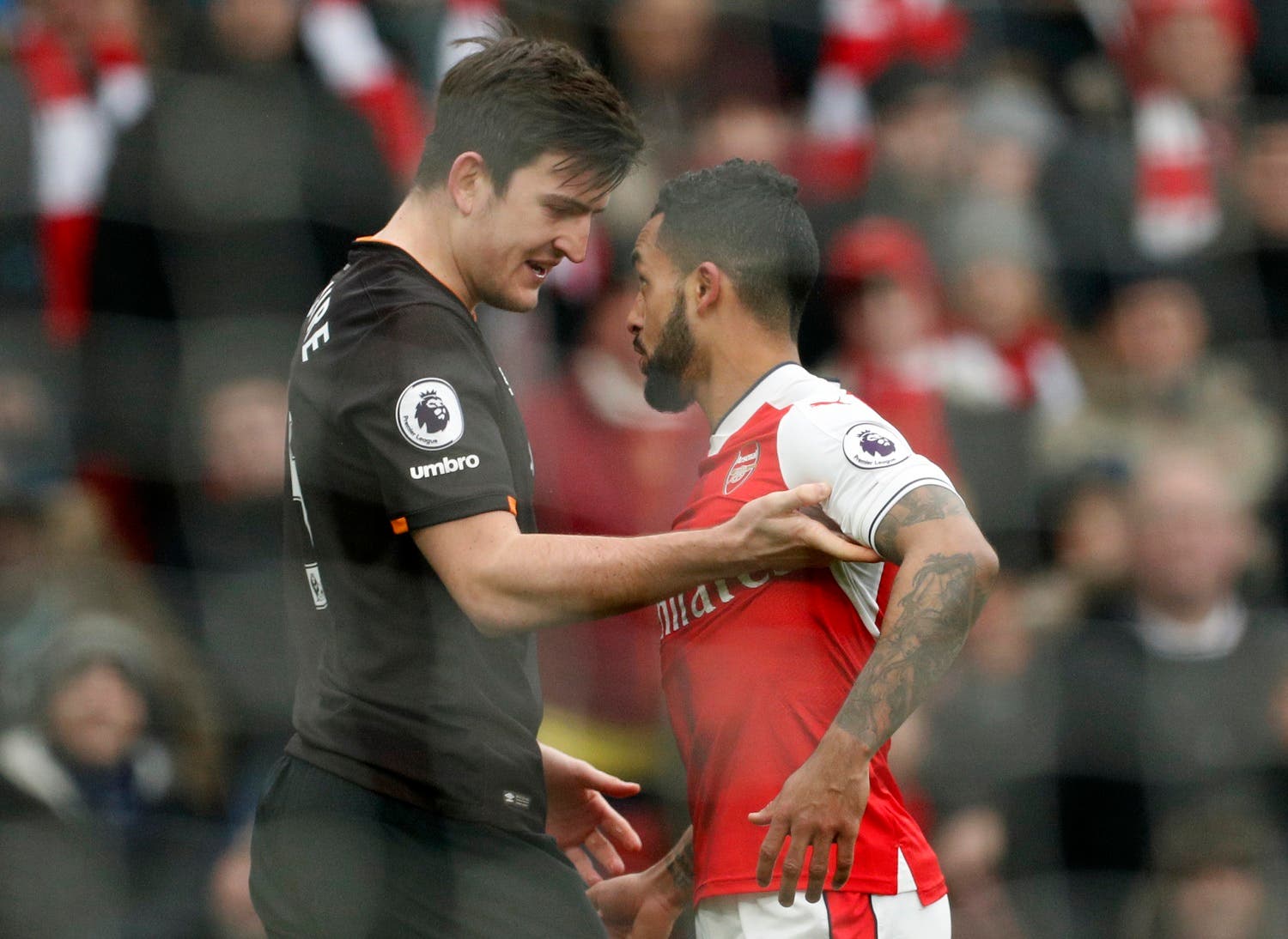 Theo Walcott (R) and Harry Maguire (L). Reuters
