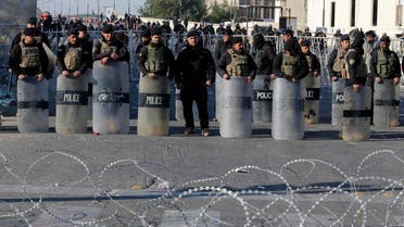 Iraqi riot police close a bridge leading to the heavily guarded Green Zone during a demonstration of followers of Iraq's influential cleric Muqtada al-Sadr in Baghdad, Iraq, Saturday, Feb. 11, 2017. (AP)