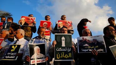 Supporters of Sheikh Raed Salah, head of Islamic Movement's northern branch, protest in the Israeli-Arab town of Umm el-Fahm against the initial approval of a bill to enforce lowering the volume of mosque loudspeakers calling worshippers to prayer, November 17, 2016. (Reuters)